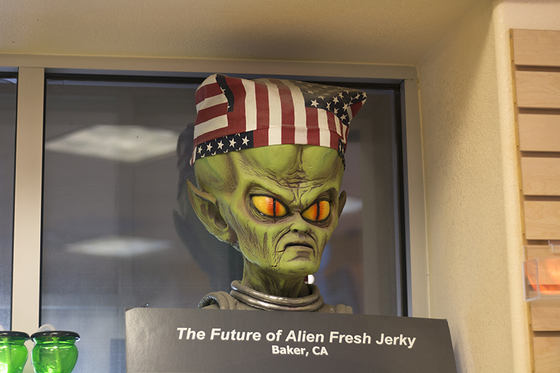 Alien head wearing an American flag bandana at Alien Fresh Jerky